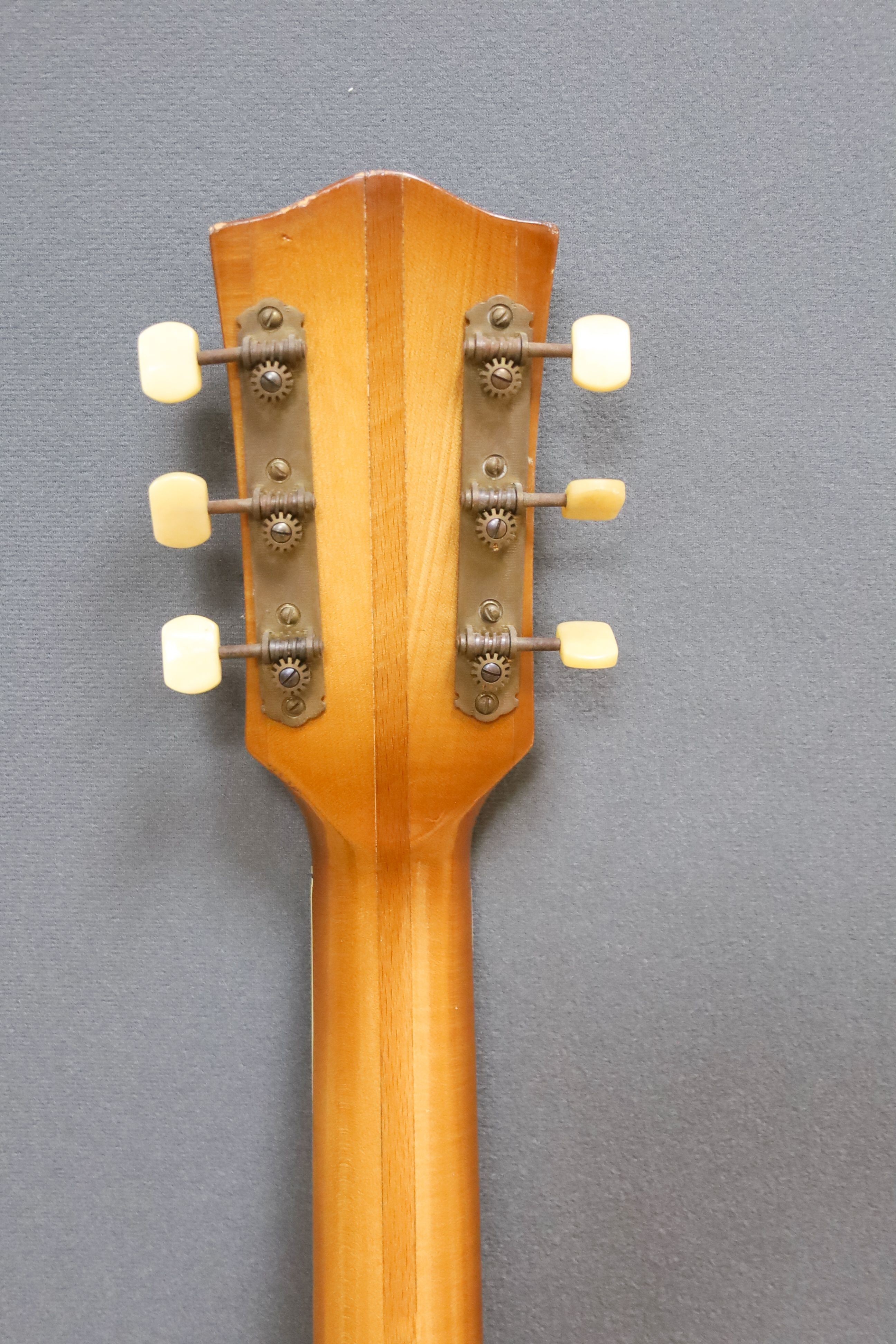 A Hofner acoustic f-hole guitar, circa 1950, having mother of pearl and tortoiseshell inlay to fret and head